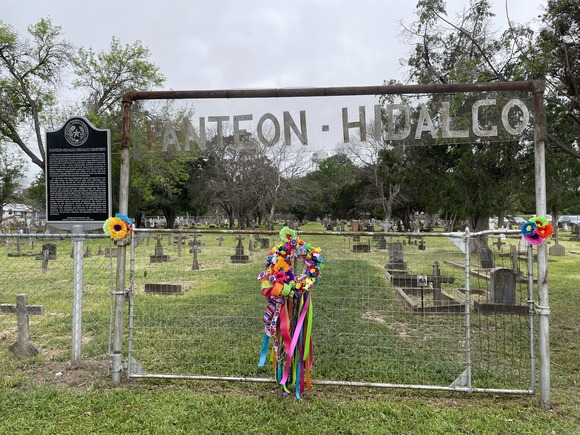 Historical marker in front of a cemetery