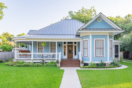 Light blue Queen Anne style cottage