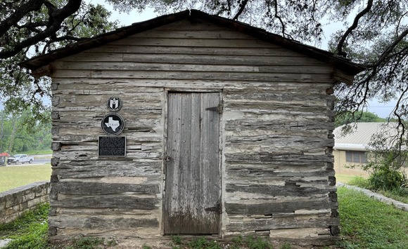 Wood cabin with Texas Historical Marker