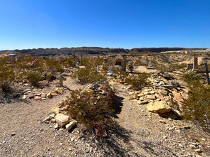 Color photo of rock mound traditional Mexican burials in Terlingua, Texas