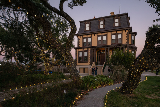 Victorian mansion with holiday lights