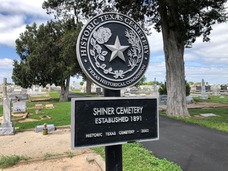 An HTC Name and Date Plaque with Medallion for the Shiner Cemetery, Lavaca County