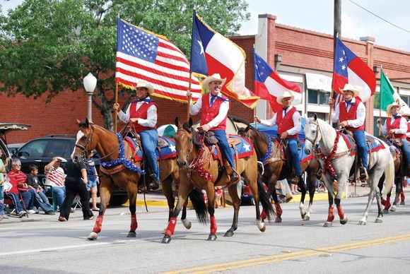Parade with Texas flag and United States flag 