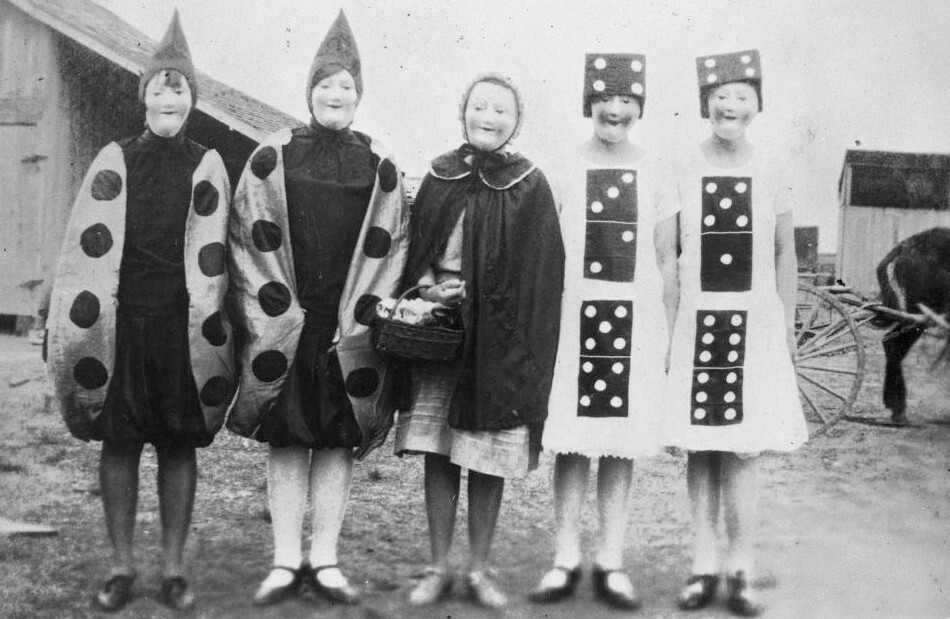 Group of Girls Wearing Costumes and Masks