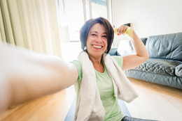 Middle aged woman exercising at home