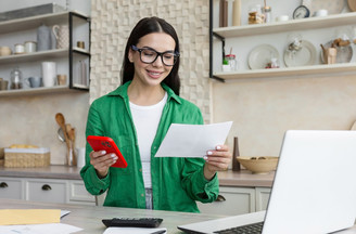 woman on phone in kitchen