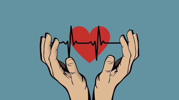 two hands holding a heart on blue background