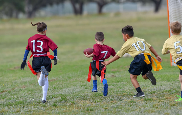 Youth playing flag football
