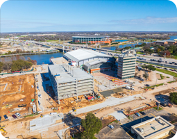 Aerial view of the Foster Pavilion basketball arena and parking garage.