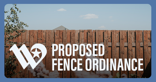 A wooden fence in a backyard