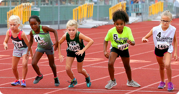 Five kids ready to run in a track competition