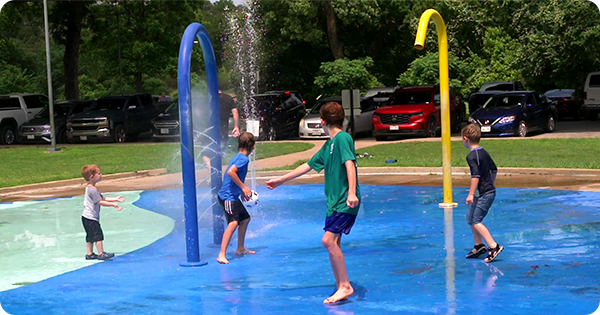Kids playing at a splash pad