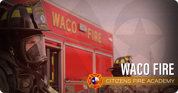 Waco firefighter in front of a red fire truck