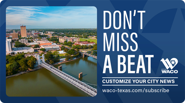 Aerial view of downtown waco, the suspension bridge, and the Brazos River.