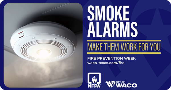 White smoke alarm on a ceiling detecting smoke in the room