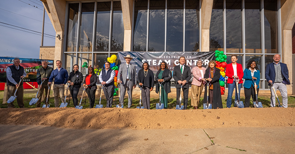 City officials and partners standing with shovels for the groundbreaking ceremony