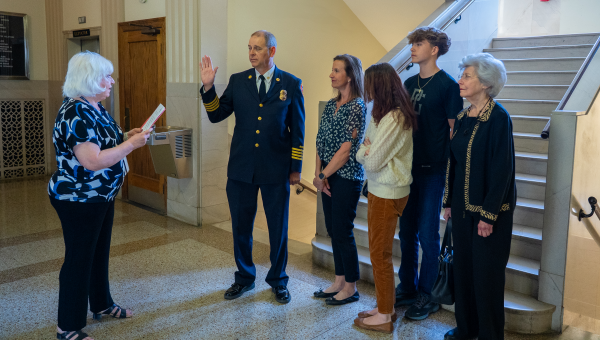 Robby Bergerson getting sworn in as fire chief with his family