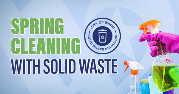 Closeup of a person spraying cleaning solution from a bottle