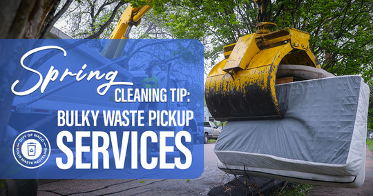 an excavator crane lifting a mattress, bulky waste pickup