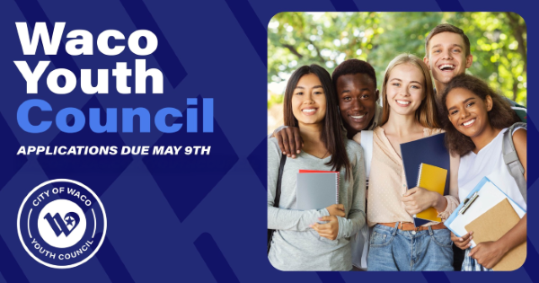 A group of diverse teenagers holding notebooks