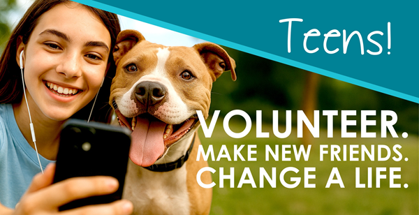 A teenage girl taking a selfie with a dog