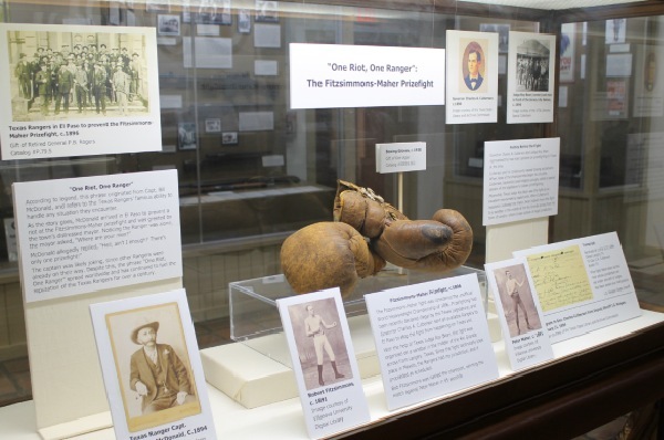exhibit with boxing gloves and photographs