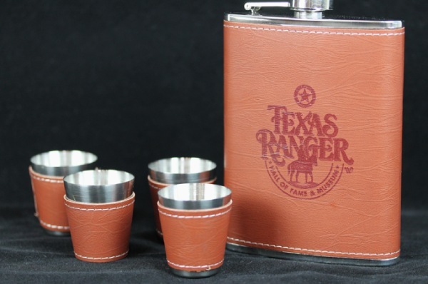 brown leather flask with four cups