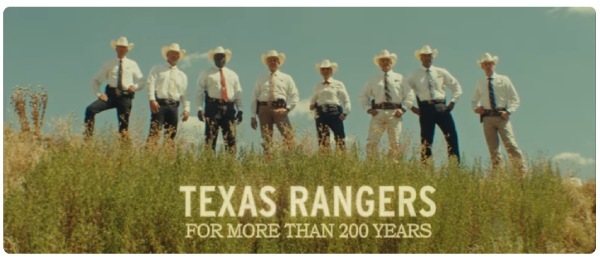Line of Rangers standing in tall grass with film title below