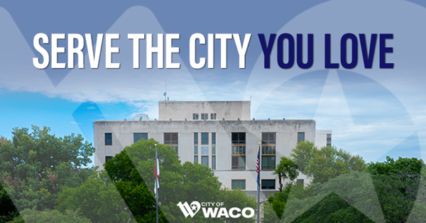 Waco City Hall, a gray building, under a blue sky.