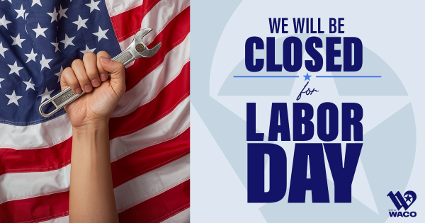 A person holding a wrench with the American flag in the background