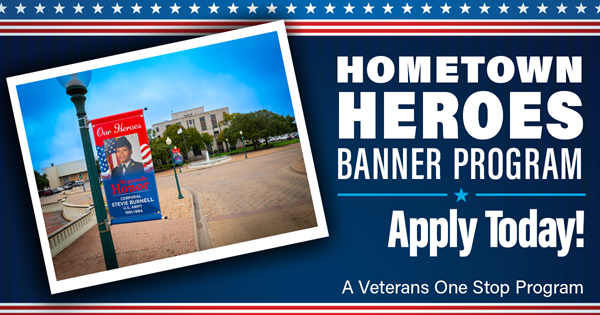 Photo of a military veteran displayed on a banner on a lamp post near City Hall