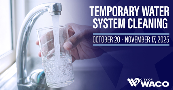 Closeup of someone serving themselves water from a faucet