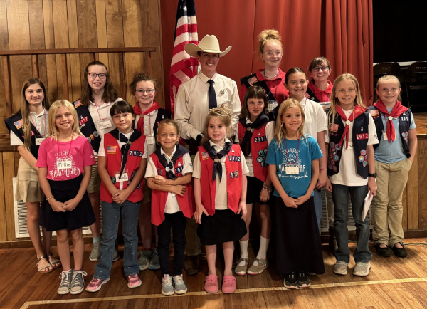 Group of girls with uniforms on and Ranger Martin