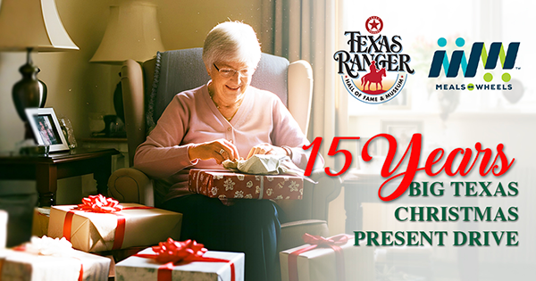 An older woman receiving a Christmas present