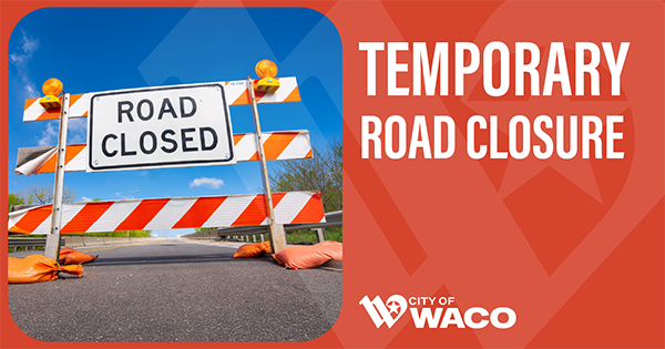 Road closed barricade and sign