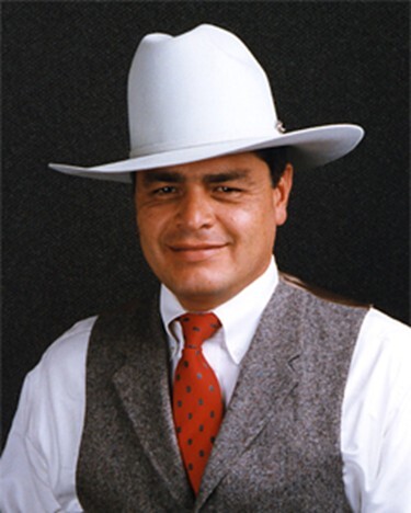 man with white hat, red tie and gray vest