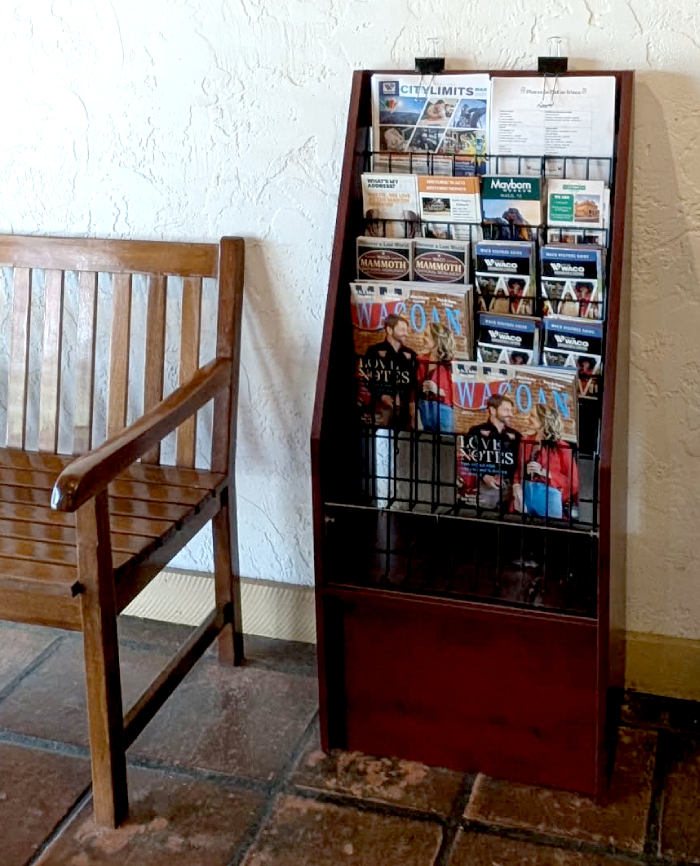 rack card holder next to wood bench
