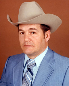 Phil Ryan in white hat and blue suit