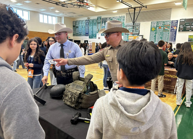DPS officers in crowded school gym