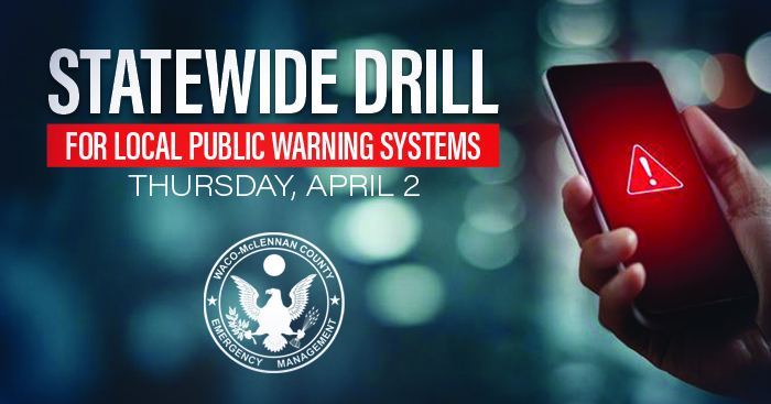 Hand holding a phone with a red alert