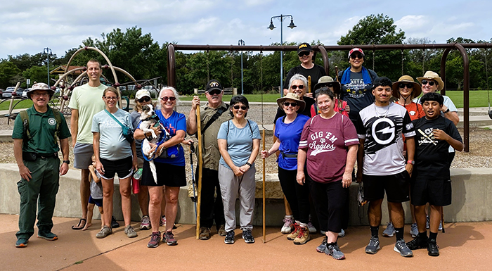 Group of people with a park ranger at a park