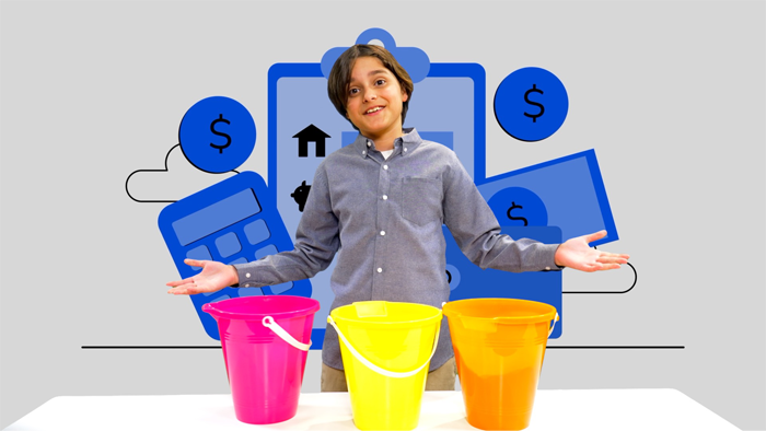 A happy kid showing different colored buckets