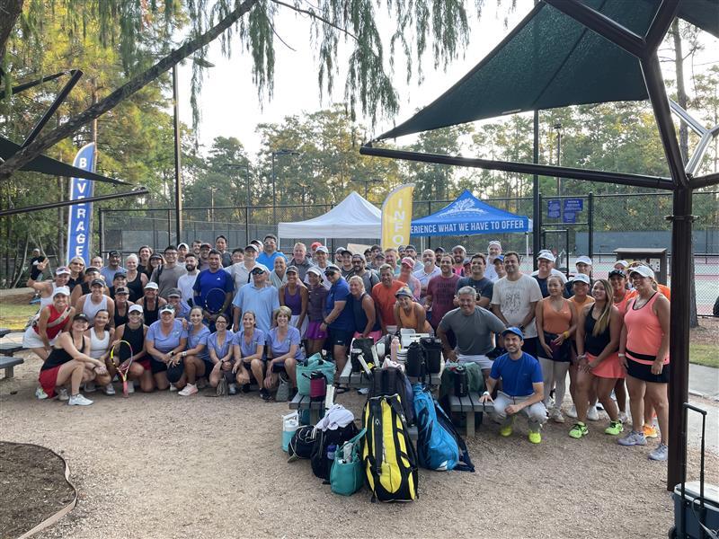 Men's and Women's tennis teams pose for a photo at Bear Branch Park Tennis Complex