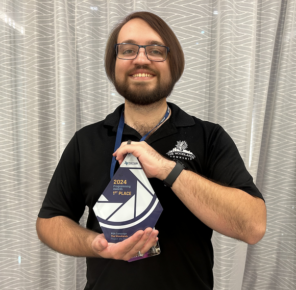 Photo of the Township’s video producer, Steven Romero, proudly holding the first-place TATOA award.