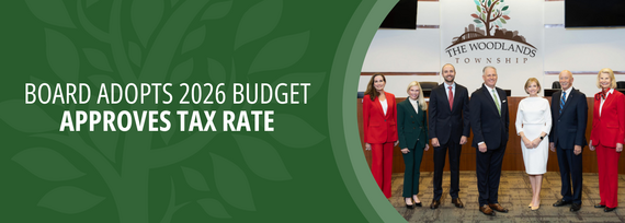 Board Adopts 2026 Budget Approves Tax Rate; Photo of 5 people standing in an office