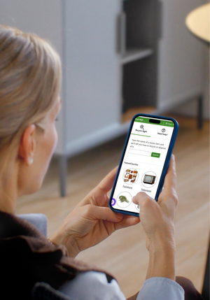 A women holding a cell phone displaying a webpage