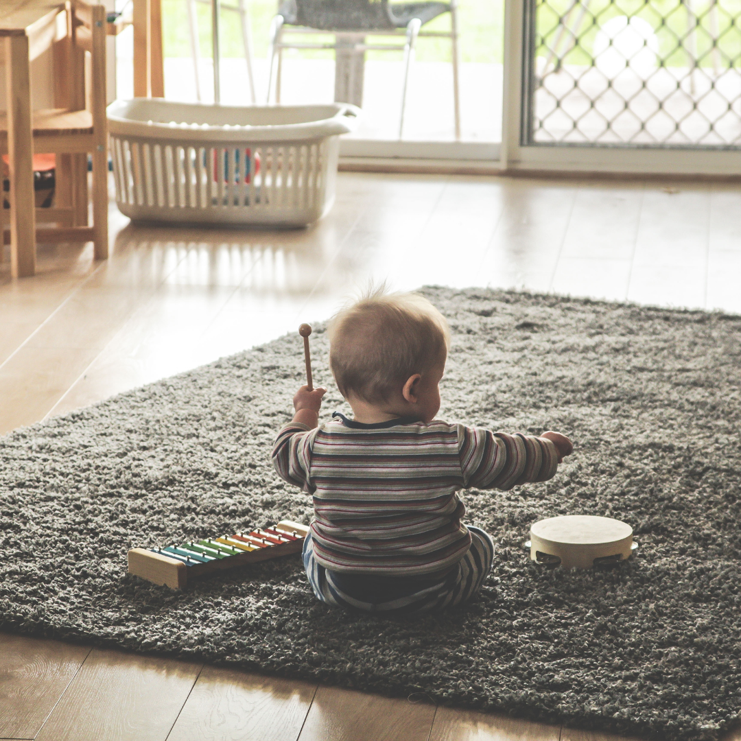 Baby playing musical instruments