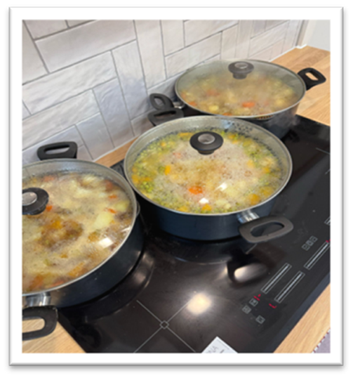 Food cooking on hob for warm space meal in Brierley.