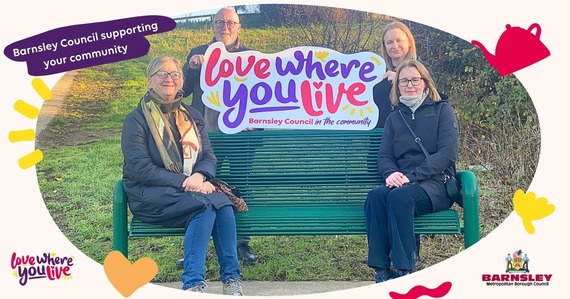 A group of people sitting a bench