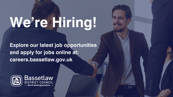 Two men shaking hands in a job interview. 